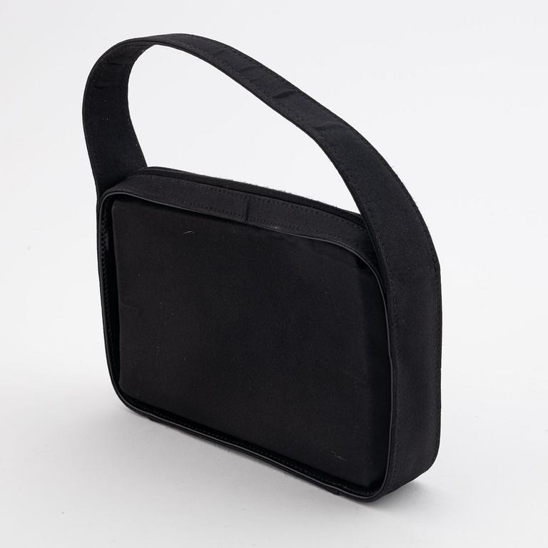 Gucci, a black satin handbag.