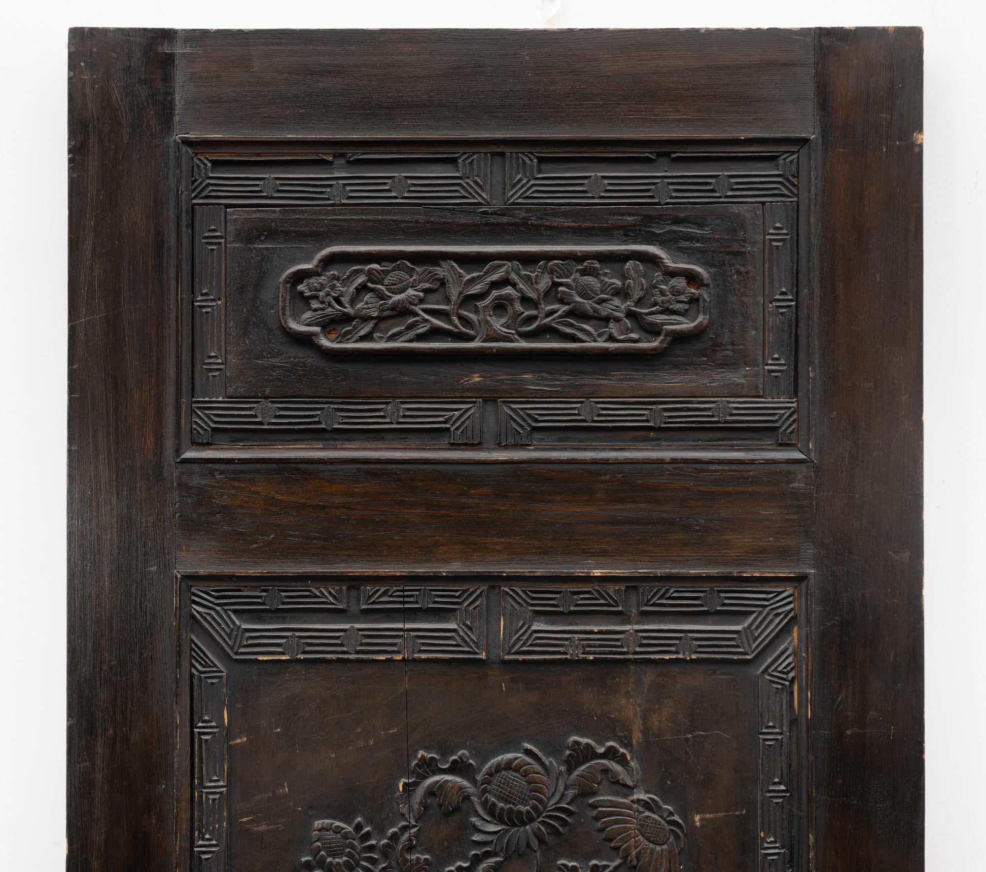 A Chinese wooden panel, Qing dynasty, 19th century.