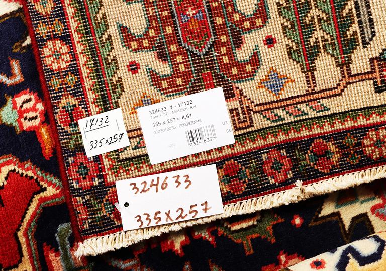 A Tabriz carpet, c. 335 x 257 cm.