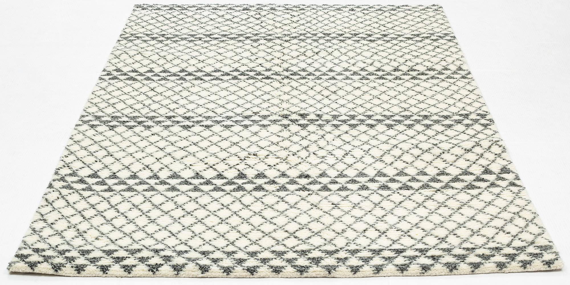 A rug of Moroccan design, ca 245 x 152 cm.