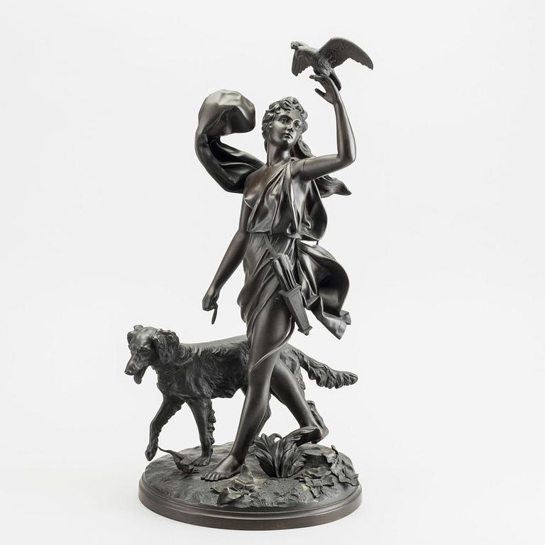 A patinated metal sculpture of of the godess Diana.