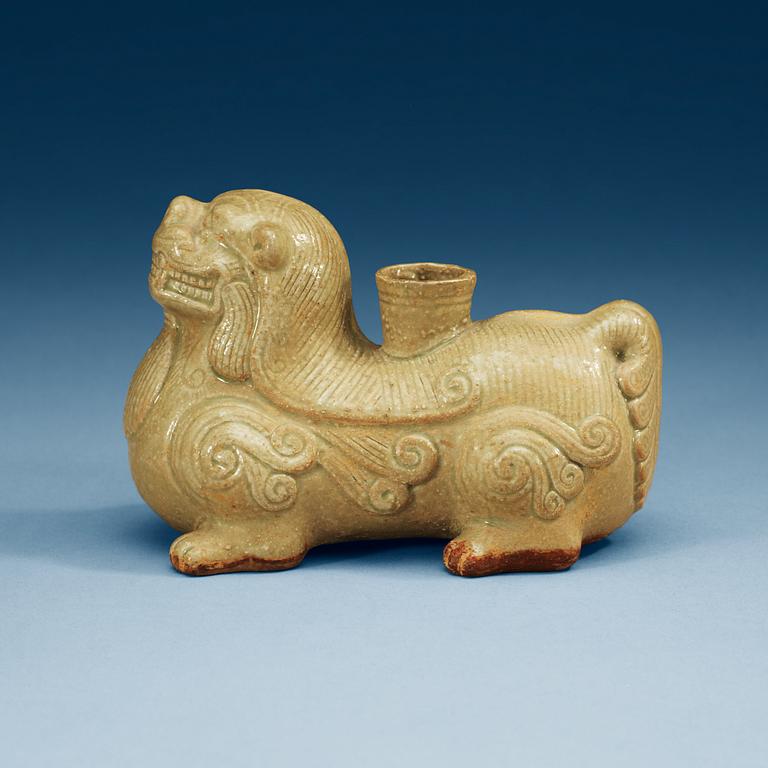 A pale celadon glazed figure of a mythological beast, Six dynasties (222-589).