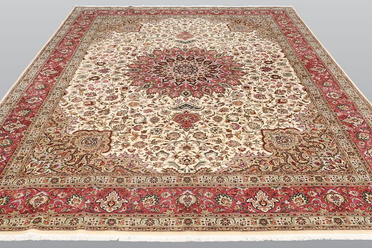 A carpet, Tabriz part silk, so called 50 Raj, cm 400 x 300 cm.