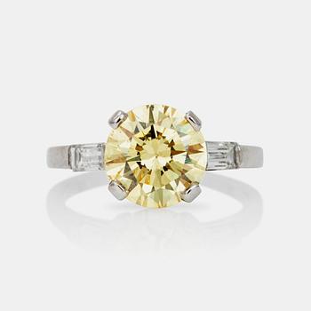 659. A fancy intense yellow diamond, 2.45 cts, solitaire ring.