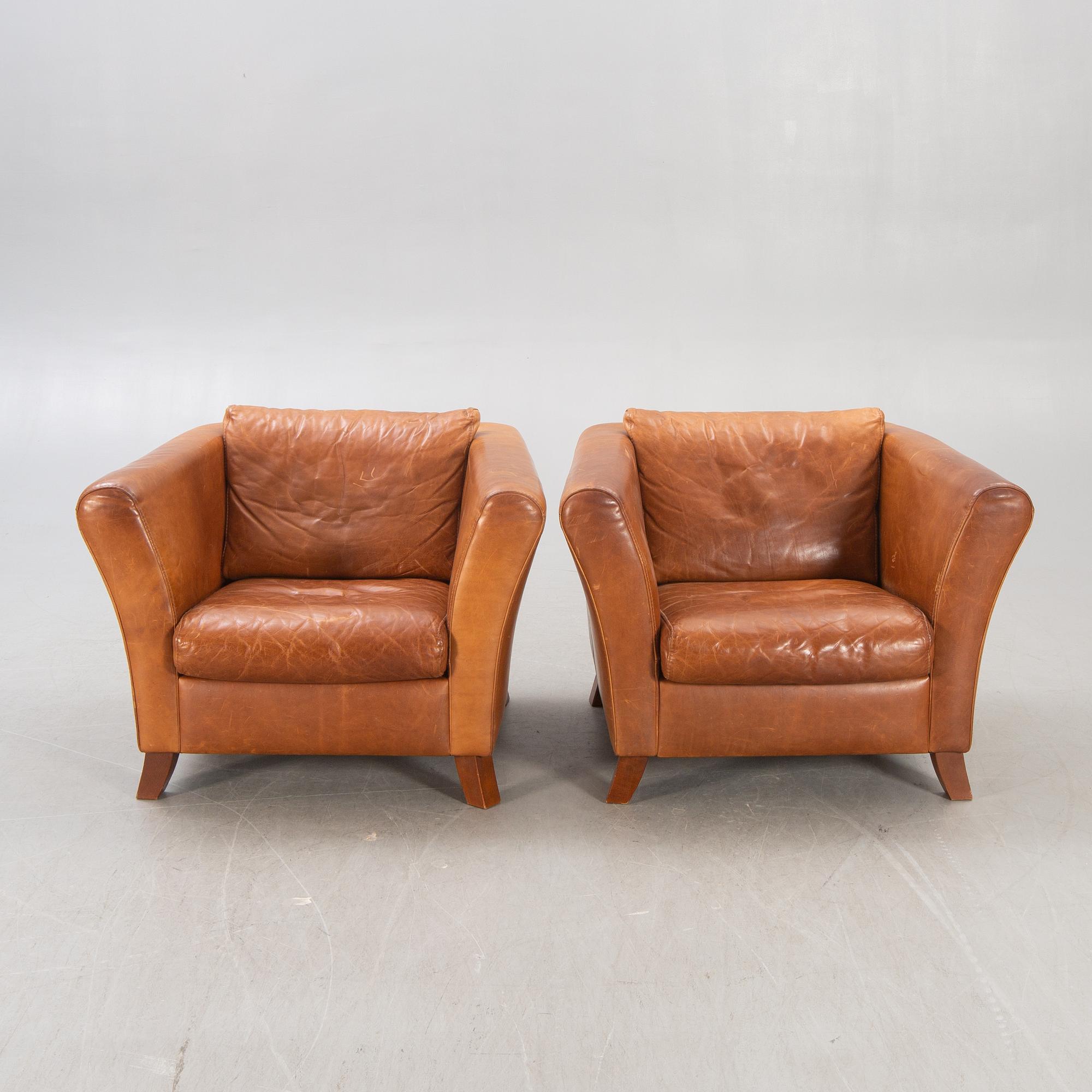 A pair of Lederland leather armchairs Netherlands later part of the 20th century.