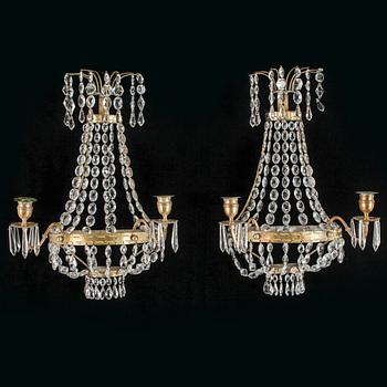 VÄGGLYSTRAR, ett par, 1900-talets första hälft.