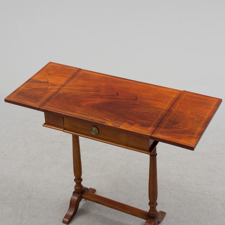 A Swedish first half of the century Karl Johan style mahogany veneered table.