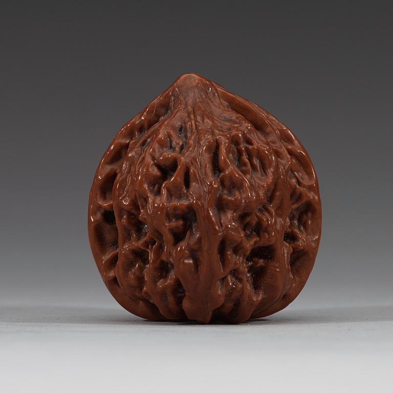 Two pairs of carved walnut hand exercisers, late Qing dynasty (1644-1912).