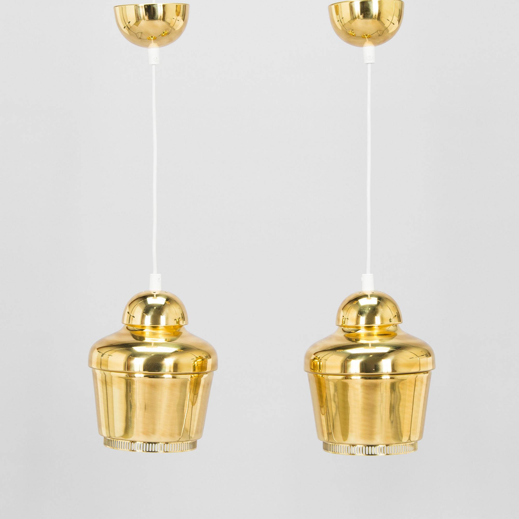 Alvar Aalto, A pair of  A 330, 'Golden Bell' pendant lights A330 for Artek, 2000s.