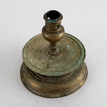 A BAROQUE BRASS CANDLESTICK, 18th century.