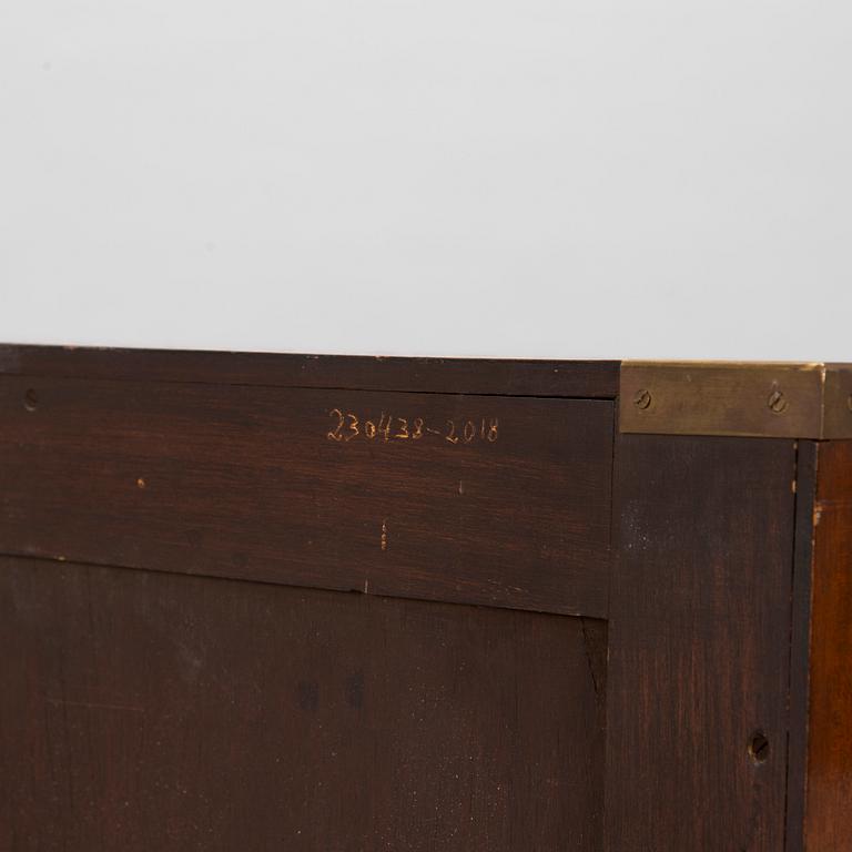 A chest of drawers, England, second half of the 20th century.