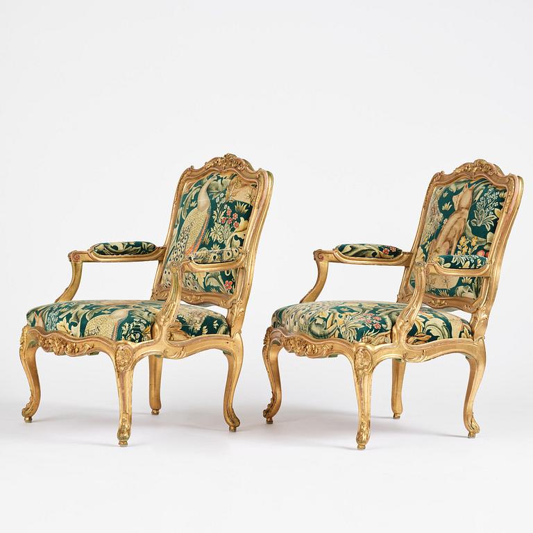 A pair of Louis XV-style giltwood fauteuils, late 19th century.