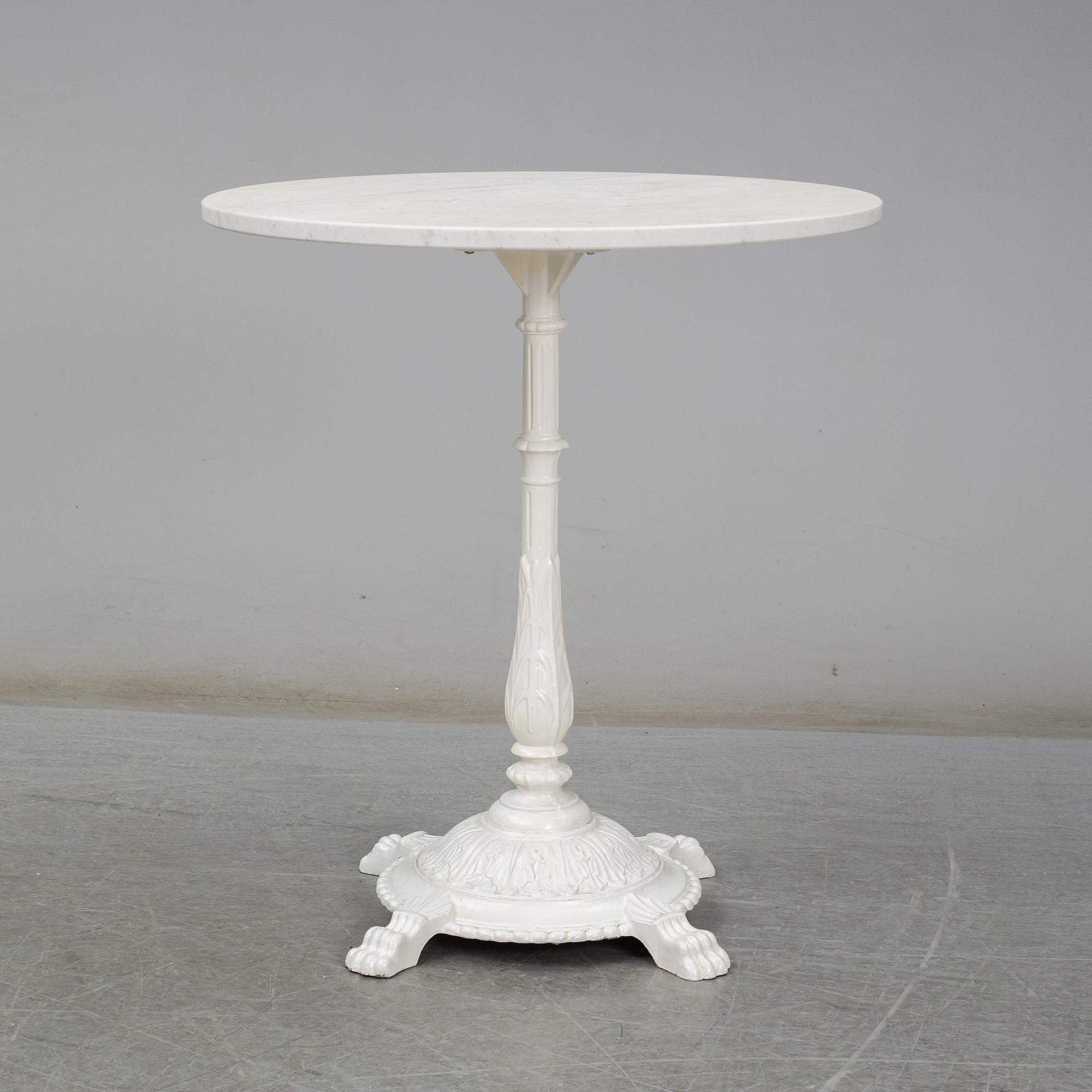 A cast iron and marble café table from Byarum.
