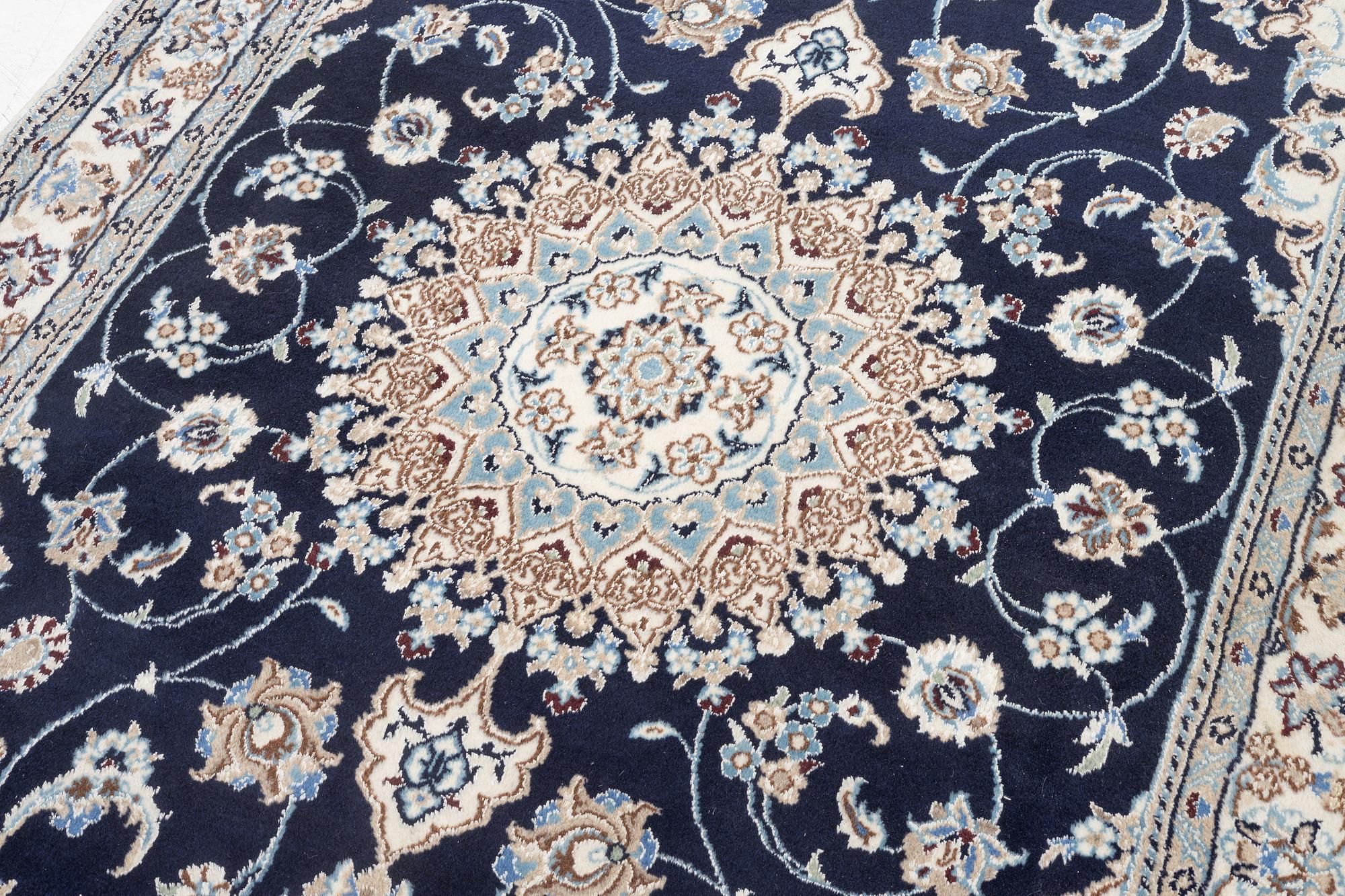 A Nain carpet, c. 255 x 150 cm.