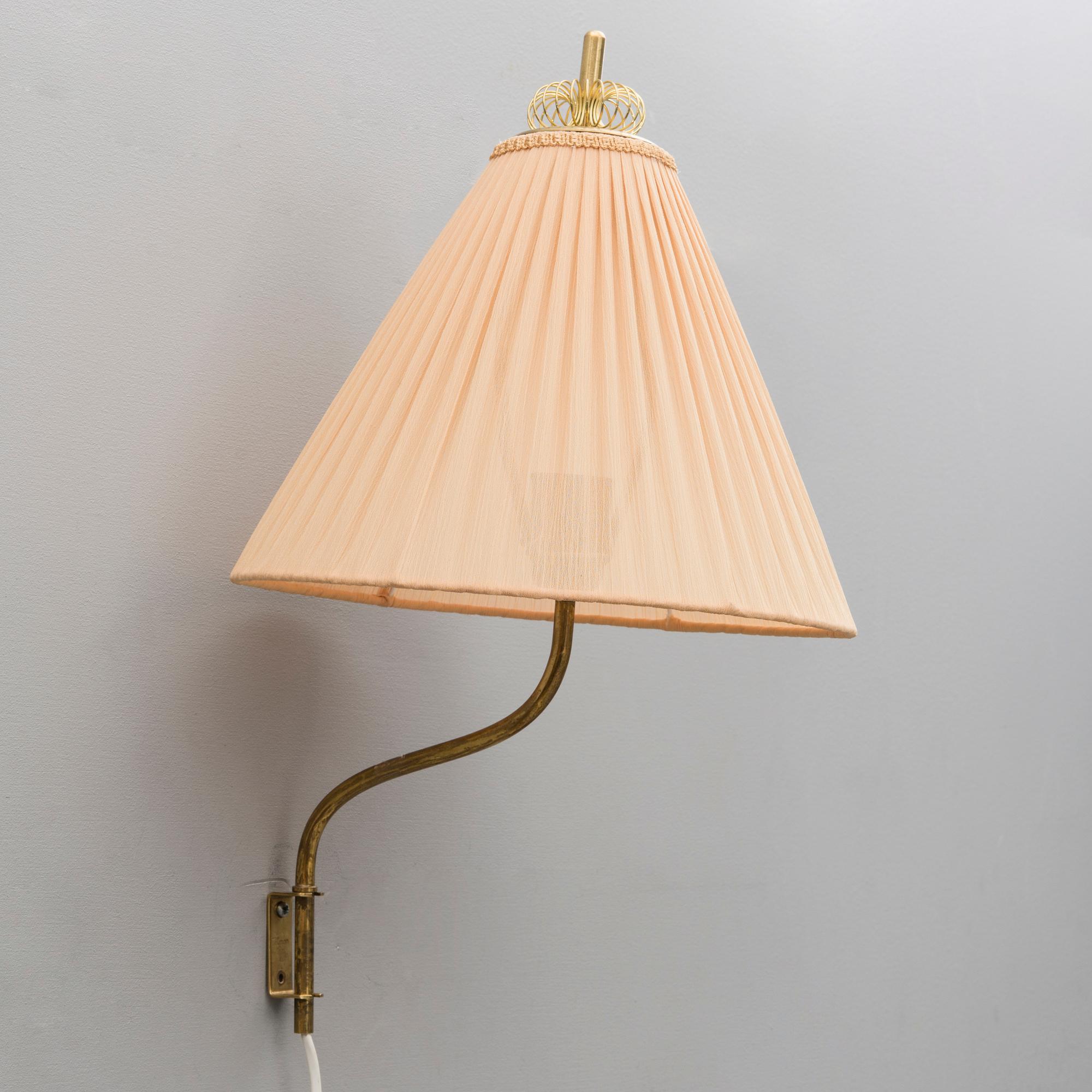 A mid 20th century wall light marked Idman, Finland.