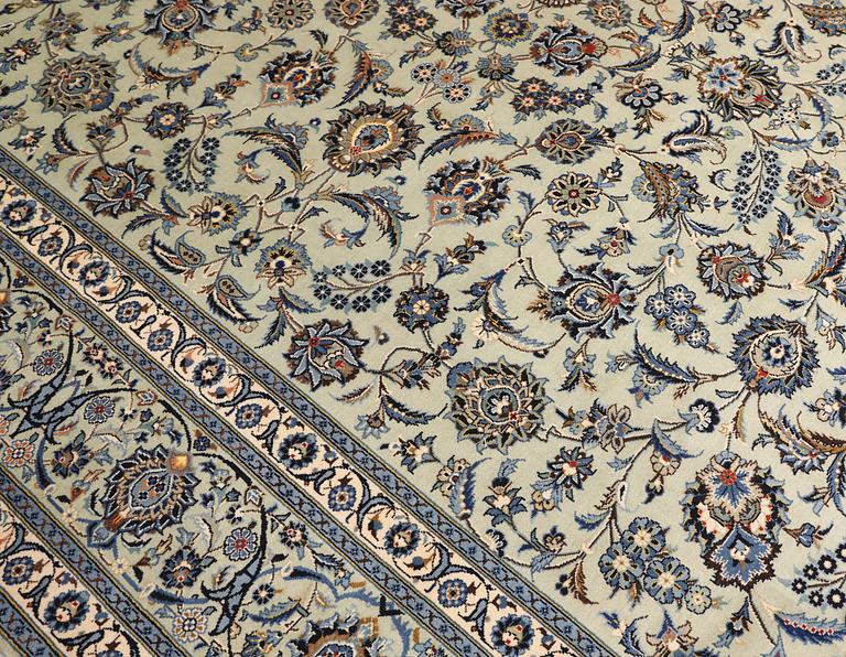 A Keshan carpet, signed, approx. 398 x 301 cm.