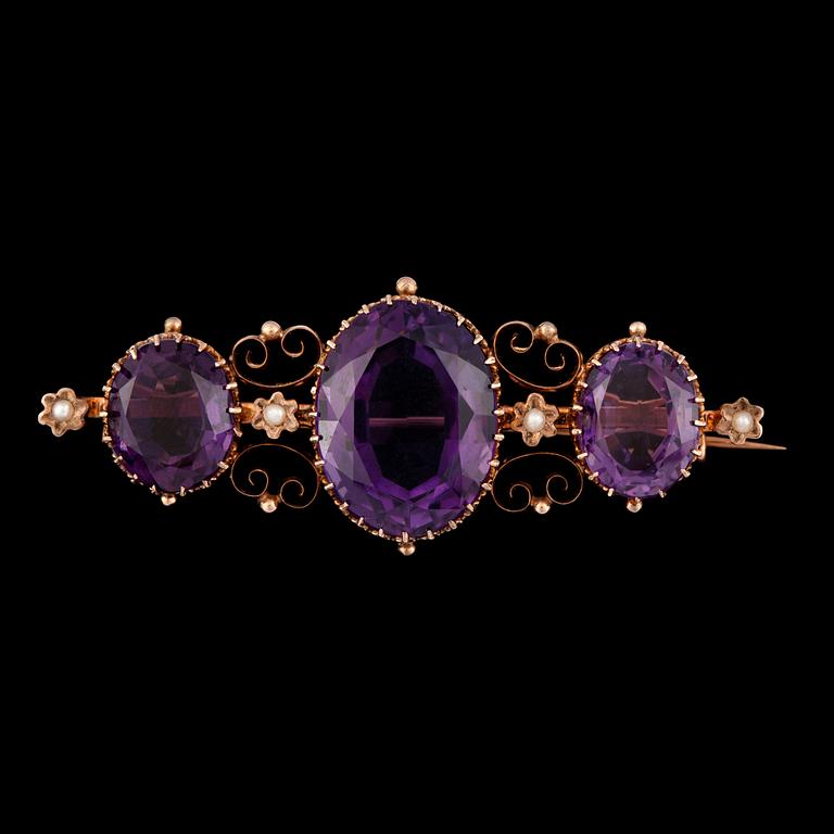 A Victorian amethyst and pearl brooch.