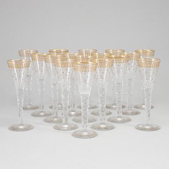 A set of 17 cut and gilded glasses, 20th Century.