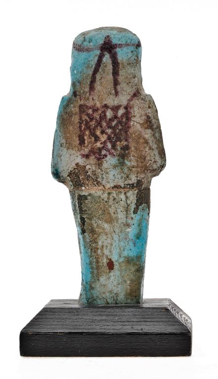 A faiance ushebeti, presumably 21 dynasty Egypt 1070-945 B C.