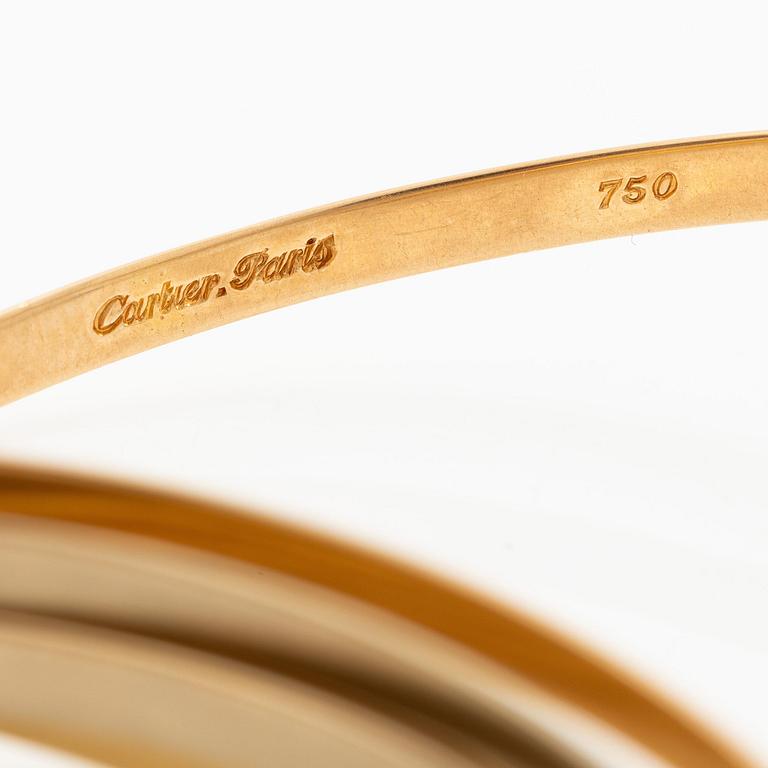 A Cartier bangle "Trinity" 18K gold in three colours.