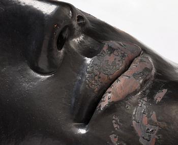 Hertha Hillfon, a black glazed stoneware wall sculpture in two parts of a face and a sky, executed in her own studio, Stockholm 1960s.