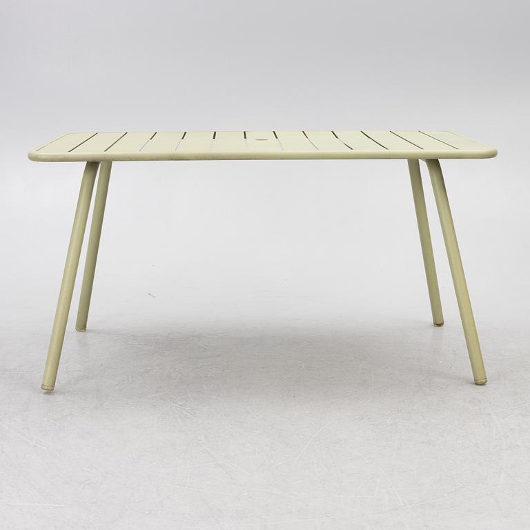 Frédéric Sofia, a table and two chairs for outdoor use, "Luxembourg" Fermob, France, 21st century.