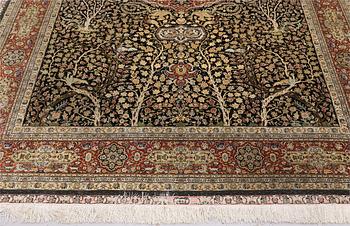 A oriental silk carpet, 303 x 201 cm.