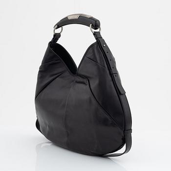 Yves Saint Laurent, a black leather and horn hobo bag.