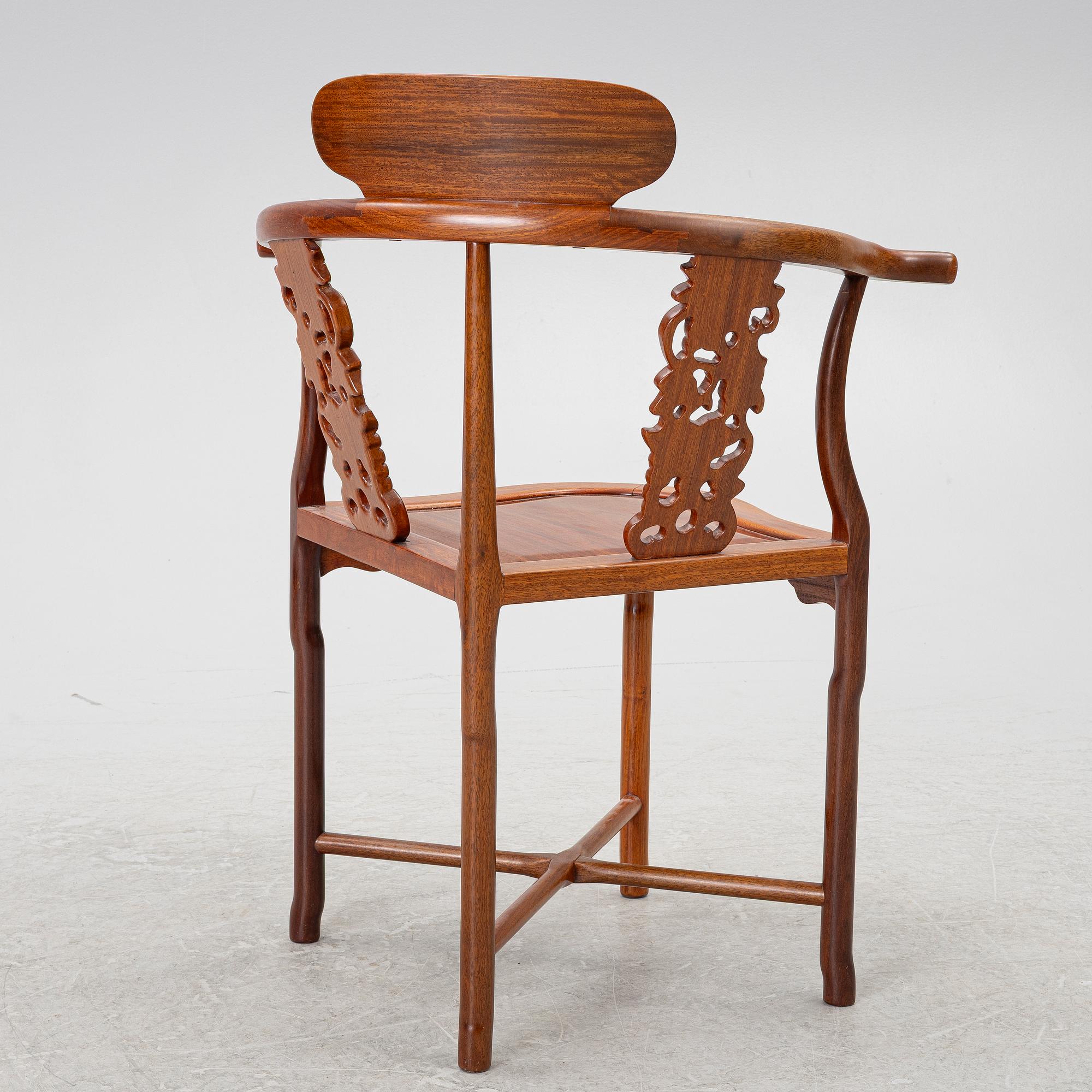 A Chinese hardwood corner armchair, 1900s.