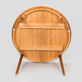 A 1960s teak and oak dining table.