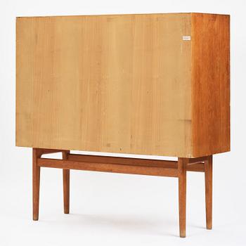 Jørgen Høj, an oak cabinet, Knud Willadsen Møbelsnedkeri, Lillerød, Denmark, 1950s.