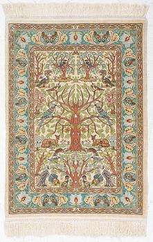A figural silk Hereke rug, c 65 x 47 cm.