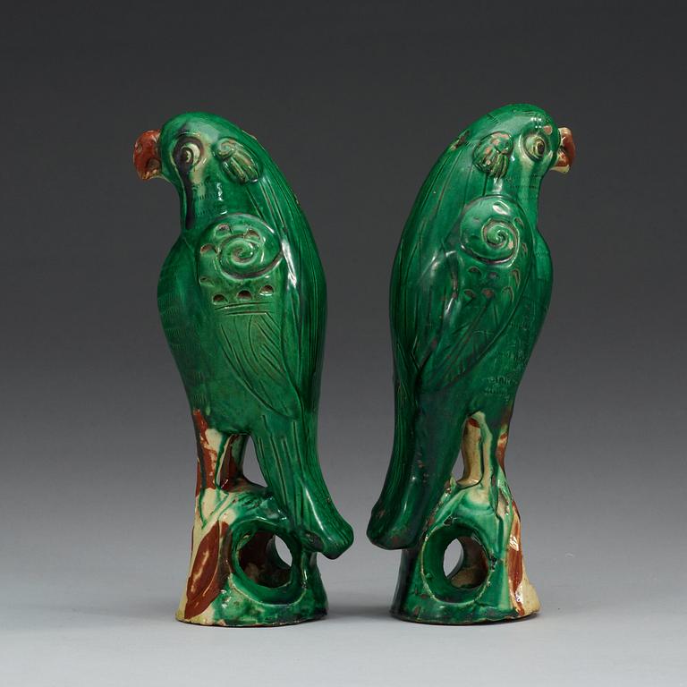 A set of two green glazed falcons, China.