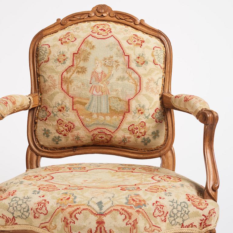 A matched pair of French Louis XV armchairs, mid 18th century.