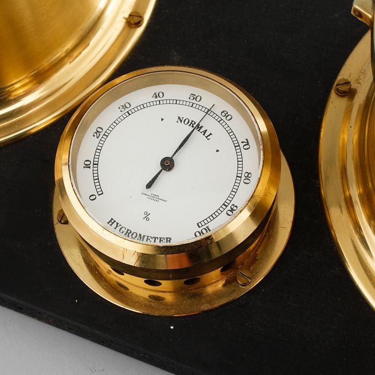 A barometer, clock and a hyglometer, 20th century.