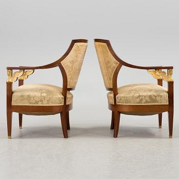 A pair of early 20th century Empire style armchairs.