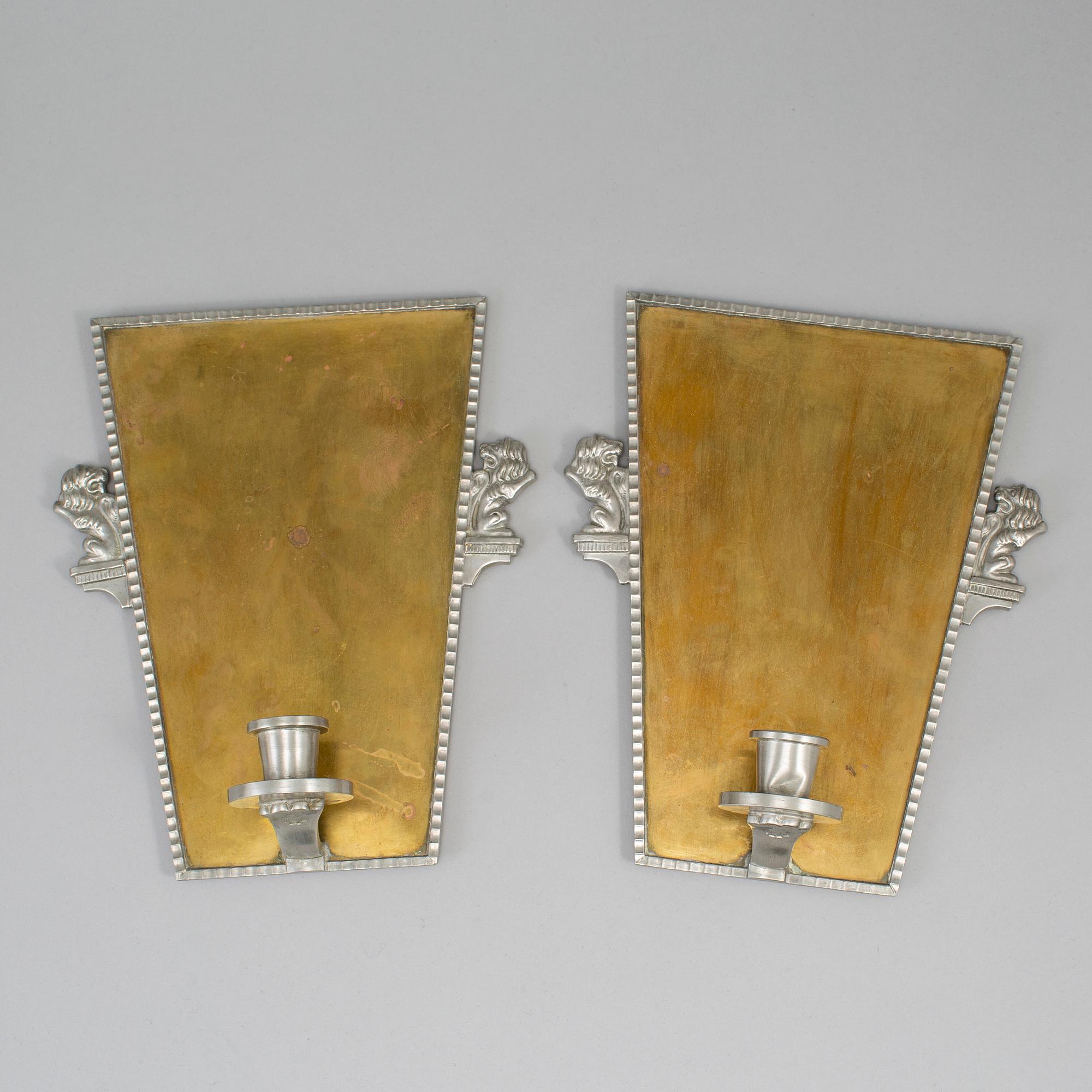 A pair of wall sconces by CG Hallebrg dated 1929.
