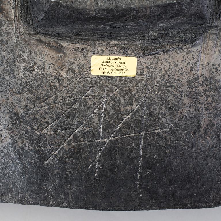 A barrel by LENA SVENSSON, raku burned pottery, sined.