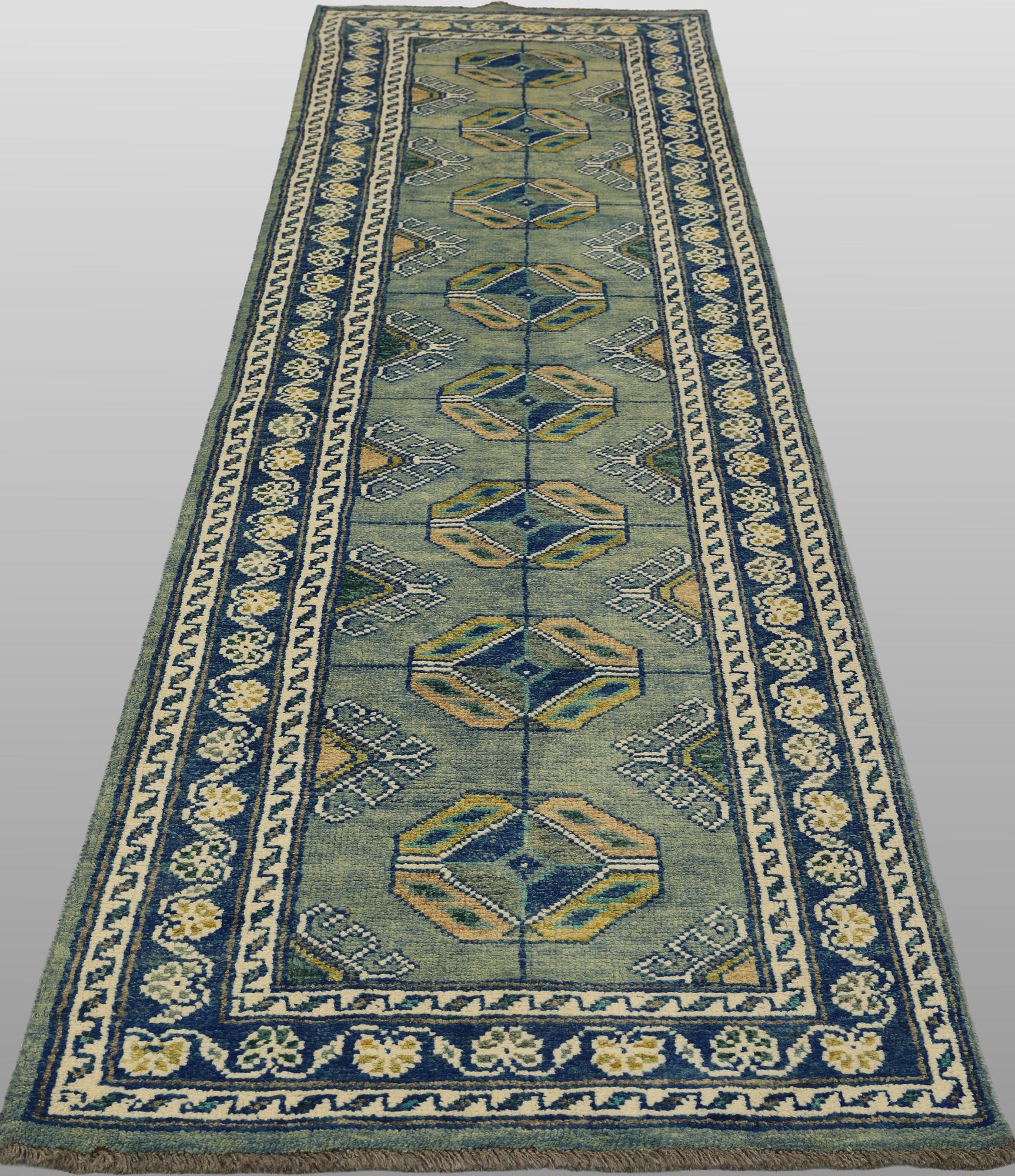 An Oriental runner, c. 296 x 77 cm.