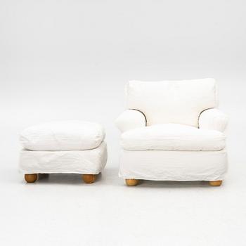 An armchair with ottoman, contemporary.