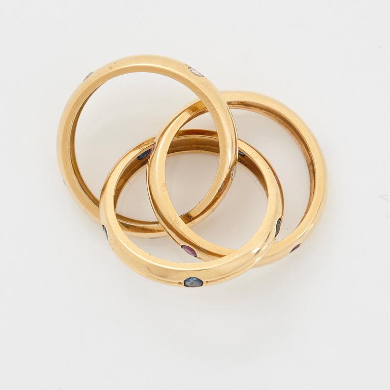 Cartier ring "Trinity" 18K guld med runda briljantslipade diamanter, rubiner och safirer.