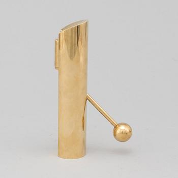 A brass candle holder by Pierre Forssell for Skultuna.