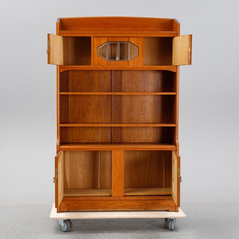 An oak cabinet and bookcase, early 20th Century.