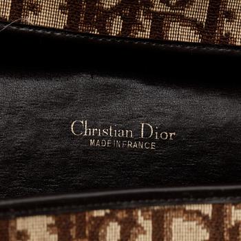 A brown monogram canvas handbag by Christian Dior.