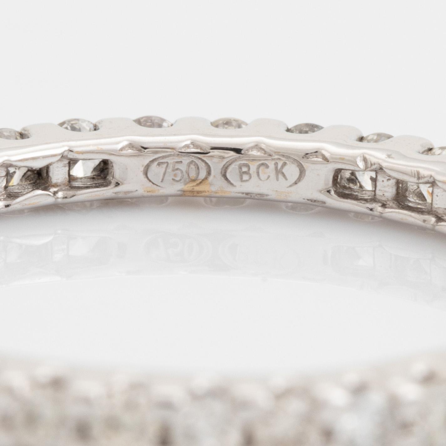 Brilliant-cut diamond eternity ring.