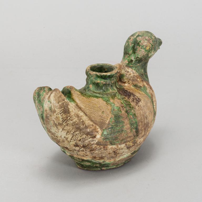 A green and yellow glazed bisquit duckshaped ewer, Ming dynasty (1368-1644).