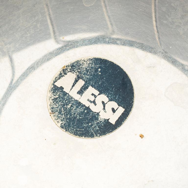 2 pieces of Alessi stainless steel table ware.