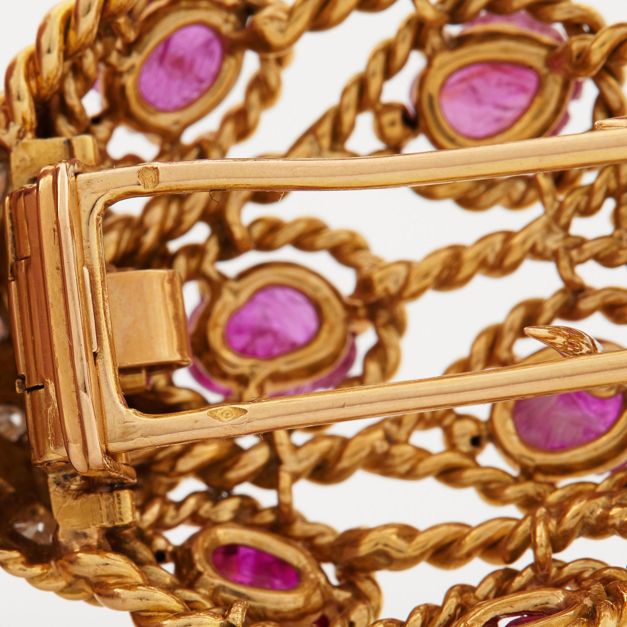 A 1950/60's brooch by Cartier, in the shape of a strawberry, set with carved rubies and brilliant cut diamonds.
