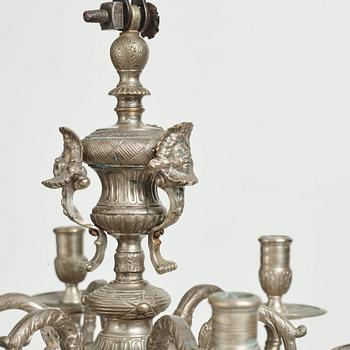 A Swedish silvered brass presumably late Baroque chandelier in the style of Jean Berain.