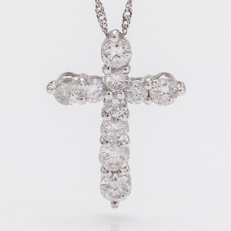 A platinum necklace with a cross pendant set with brilliant-cut diamonds 0.52 ct acording to engraving.